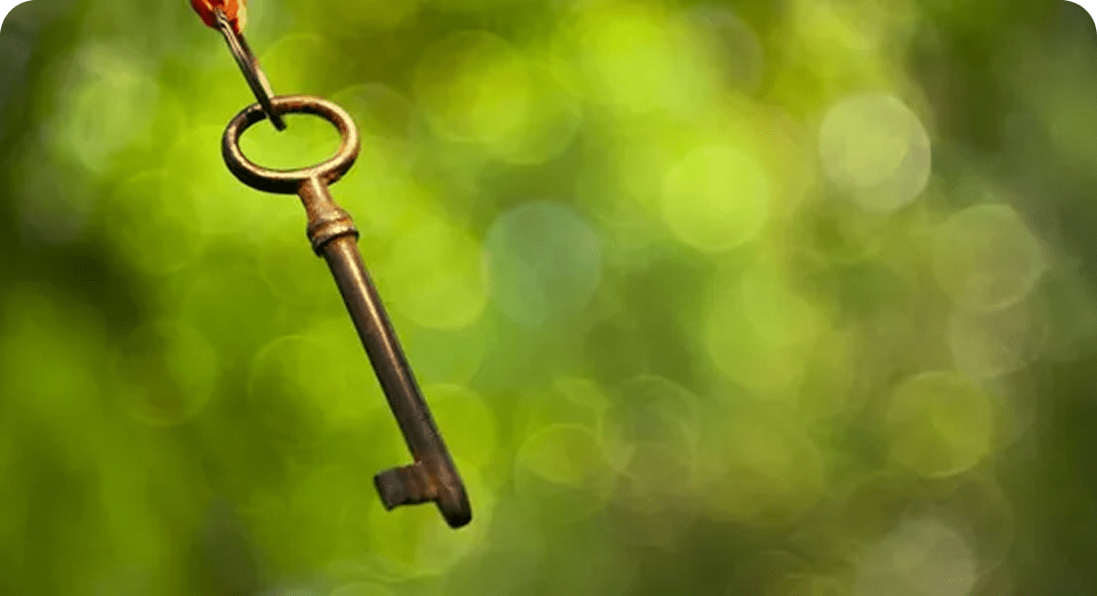 Old-fashioned key with blurred backdrop