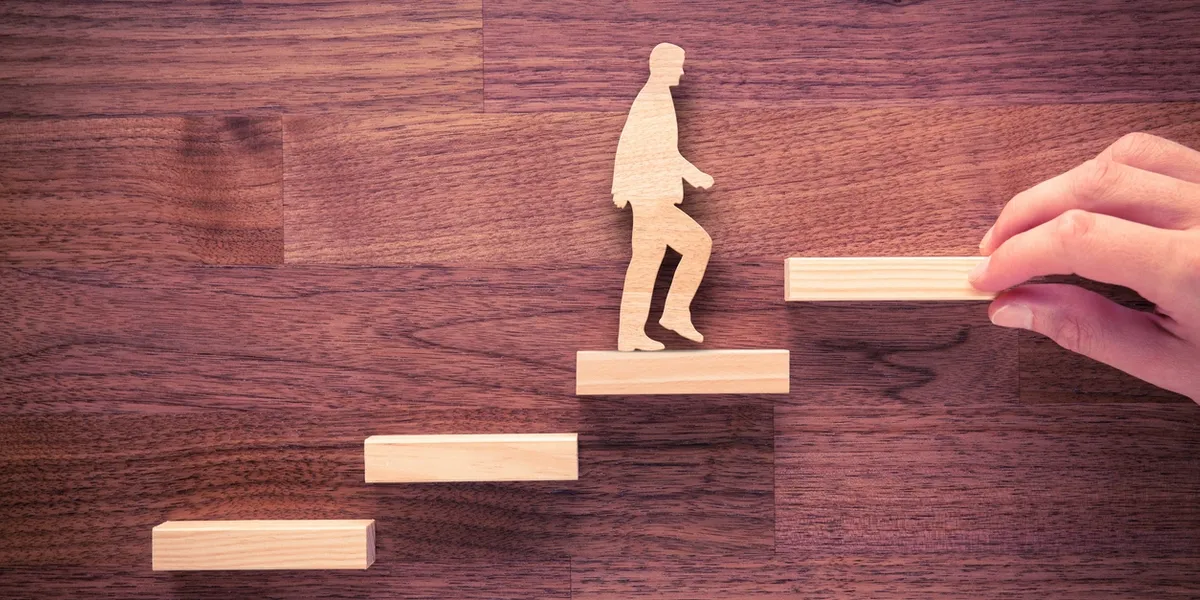 Wooden figure climbing block stairs