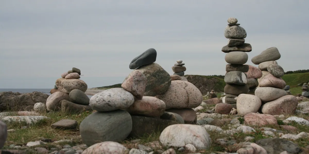 Stacked stones on a grassy landscape