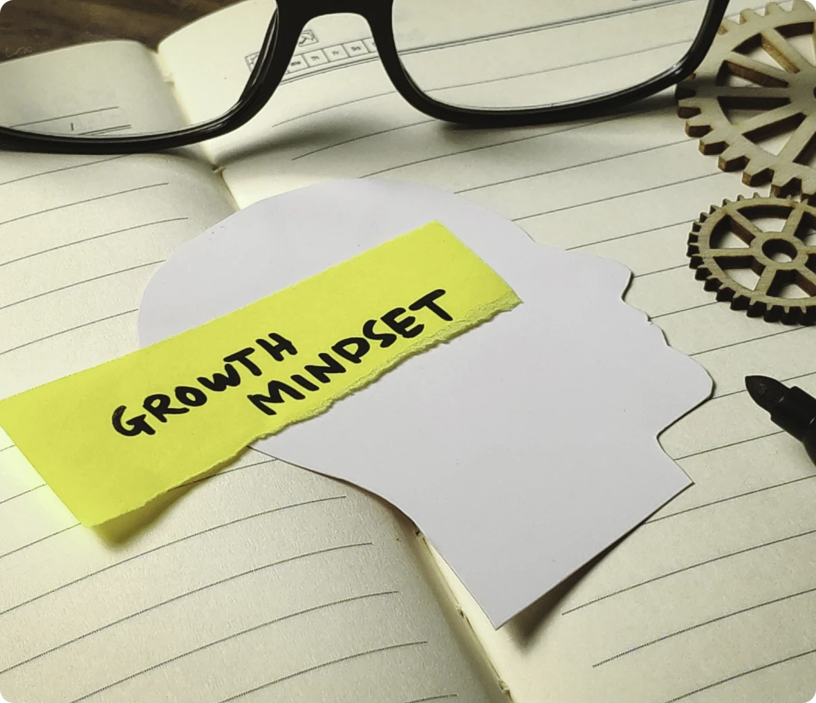 Growth mindset note on paper silhouette